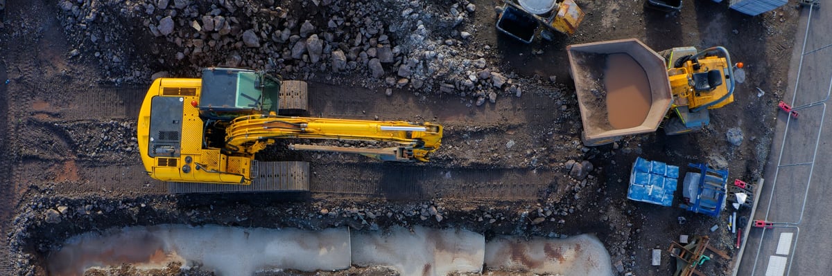 Aerial view of a construction site with stored materials