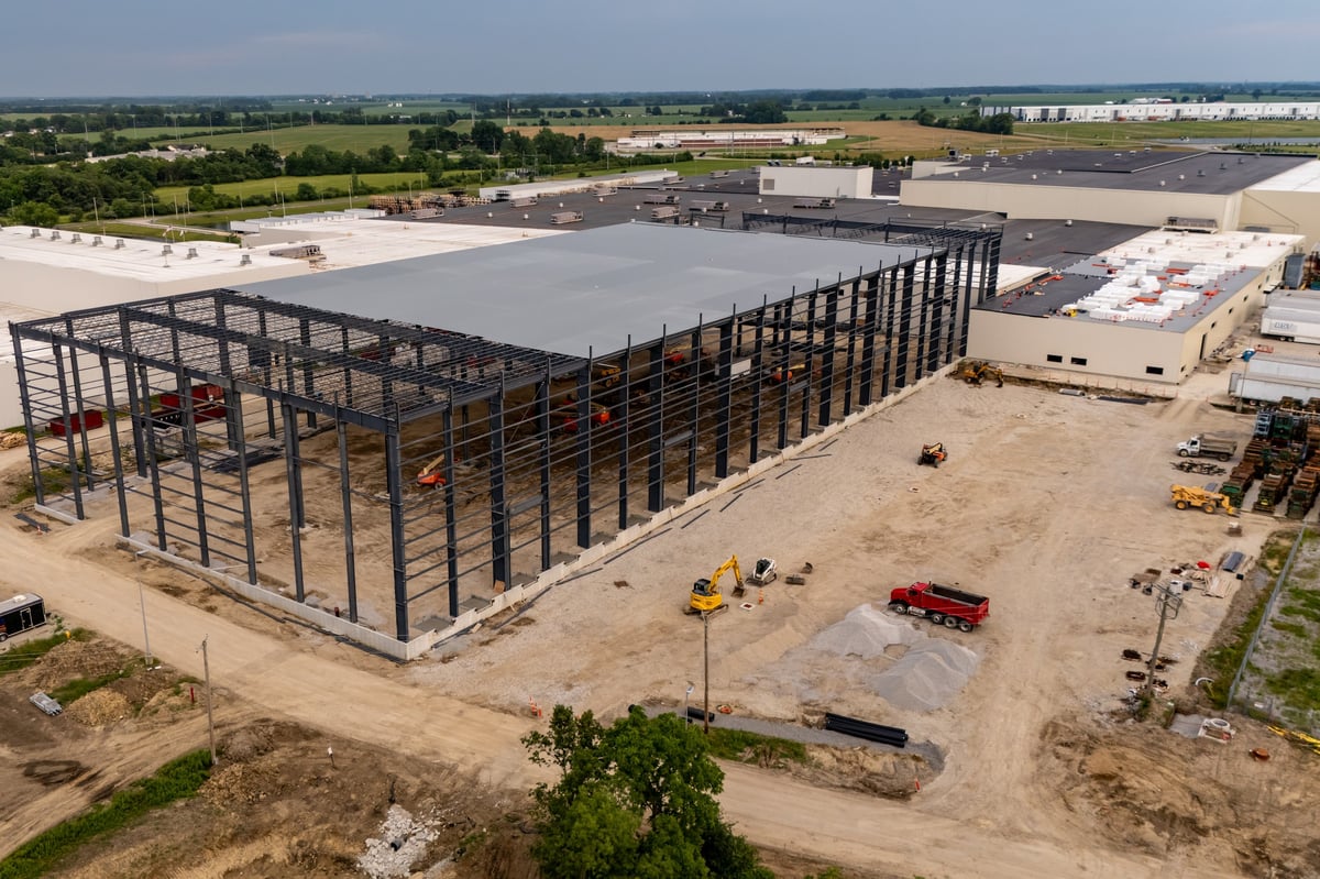 Skeletal steel structure of a future warehouse on an open construction site